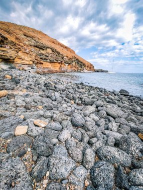 rocky coastline with a large stone