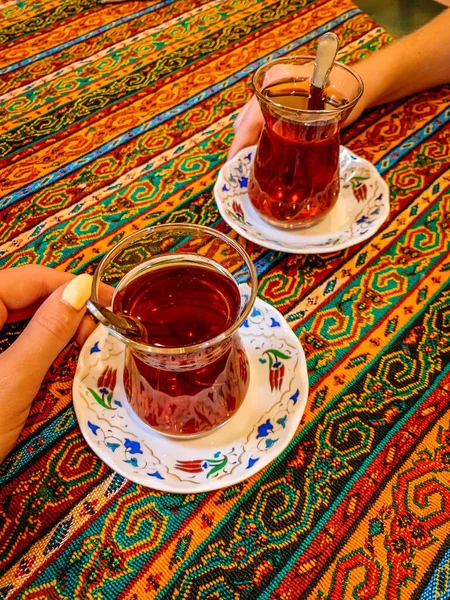 turkish tea in a cup on a background of a red and white