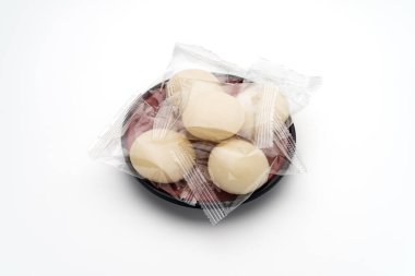 Individually wrapped Japanese rice cakes 'mochi' clipart