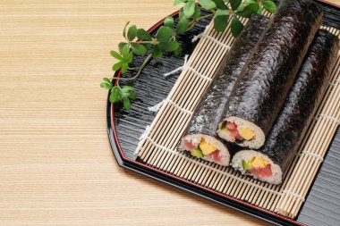 Eho-maki are thick sushi rolls which is believed to bring good fortune if eaten while facing the year's 