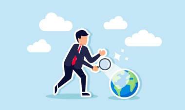 Bir işadamı, Dünya 'yı bir büyüteçle inceleyip aydınlatıyor ve gezegendeki yaşamın sürdürülebilirliğine ve devamlılığına dikkat çekiyor.