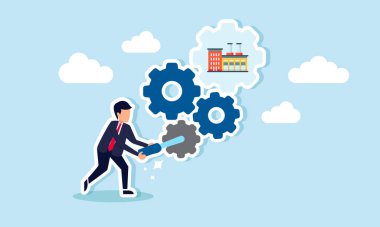 Fabrika olarak etiketlenmiş bir dişli makinesi kuran bir işadamı, fabrikadaki bakım ve performans ayarlamalarını gösteriyor.  