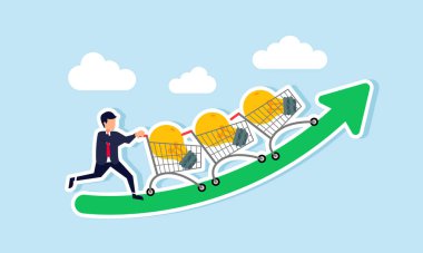 Bir işadamı, yükselen yeşil bir tabloda ışıklarla dolu bir sıra alışveriş arabası itiyor, ticari büyüme ve iyileşme için ticari fikirlerin gösterimi