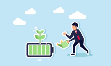 Bir iş adamı filizlenen bir bataryayı suluyor.