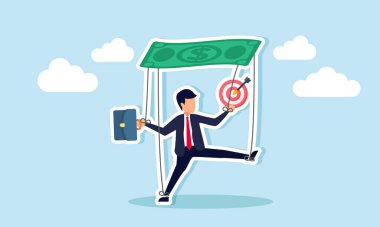 Dolar parasına bağlı bir kukla gibi bağlanmış bir iş adamı, ticari hedeflere ulaşmak için bağlayıcı iş projesinin kurallarını gösteren bir hedef tahtası bulundurur.