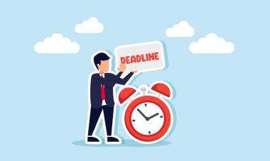 Bir işadamı, çalar saatin yanında DeADLINE yazan bir pano tutuyor. Son teslim tarihini hatırlatması için.