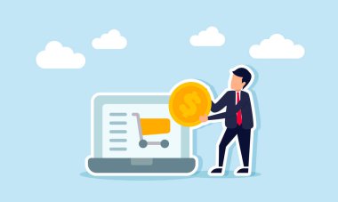Bir iş adamının elinde bir dolar para var. Bir dizüstü bilgisayarın yanında duruyor. Alışveriş arabası sergiliyor.