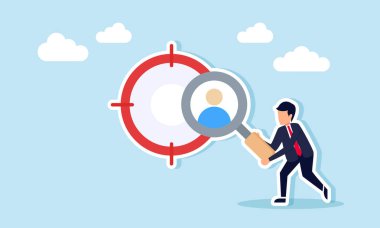 Hedef kitlesinin yanında duran bir işadamı elinde büyüteçle bir kişinin profilini inceliyor ve yeni çalışan adaylarını arıyor.