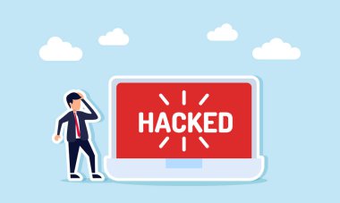 Hacklenen sözcüğü gösteren dizüstü bilgisayara şaşkın bir şekilde bakan işadamı, hacklenen bir bilgisayarın sebep olduğu kafa karışıklığının bir göstergesi.