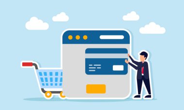 Çevrimiçi ve dijital ödeme sisteminin uygulama arayüzü ve alışveriş arabası illüstrasyonunun yanında kredi veya banka kartı tutan işadamı