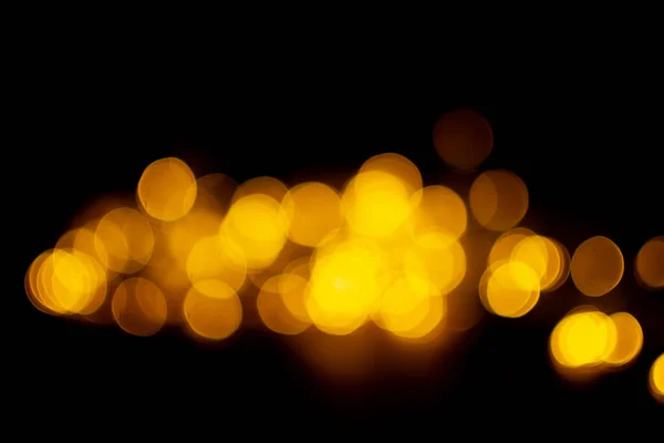Bokeh Effect Gouden Lichten Zwarte Achtergrond Sprankelende Sterren Kort Glinsterend — Stockfoto