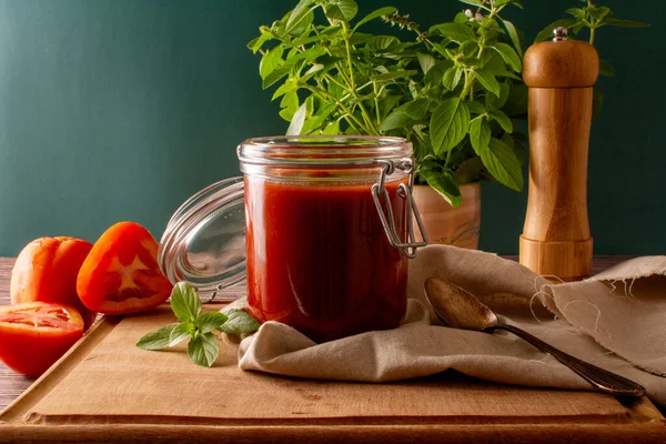 Fresh Tomato Sauce Glass Jar Wooden Table Green Background Front — Stock Photo, Image