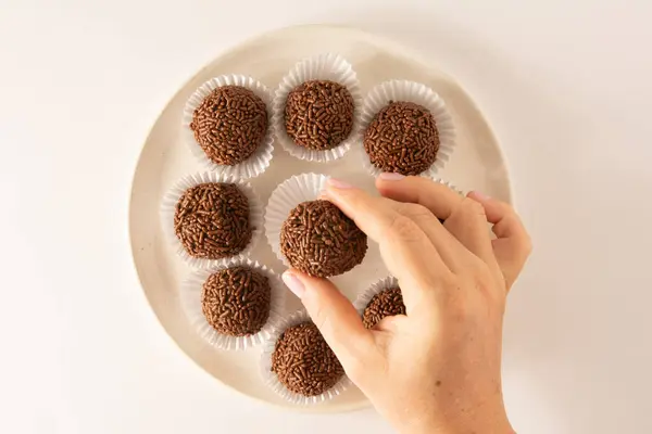 stock image Brigadeiro brazilian chocolate truffle balls party candy with chocolate flakes aerial view clean background