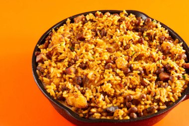 Baiao de Dois traditional Brazilian food made with rice, beans, sausage and rennet cheese clipart