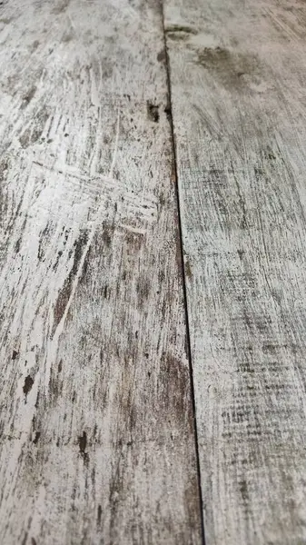 Yıpranmış ahşap bir yüzeye yakın plan, rustik tasarımlar, klasik temalar veya dijital sanat projeleri için dokular için mükemmel..