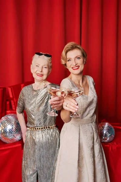 Two Women Mature Senior Celebrating New Year Holding Hands Glasses — Stock Photo, Image