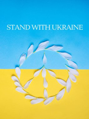 peace sign of white petals on the blue and yellow background. Ukraine flag colors