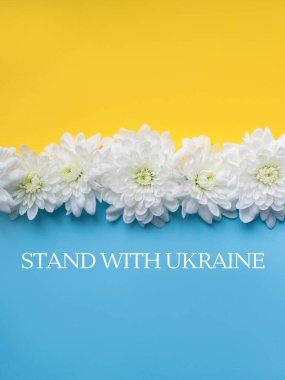 Stand with Ukraine written on Blue and yellow background. 