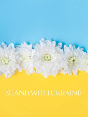 Stand with Ukraine written on Blue and yellow background. 