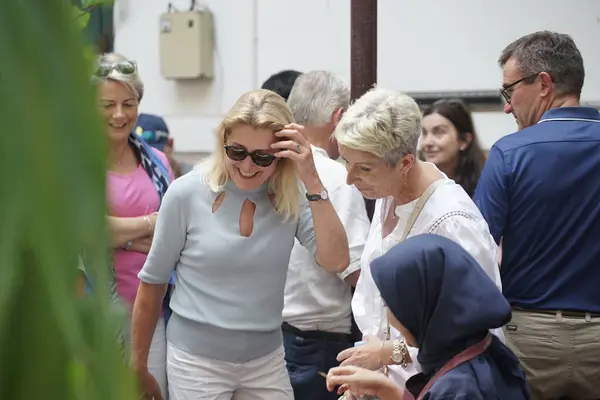 stock image jakarta, indonesia june 17 2023 : 2 women are looking at a work of art while laughing