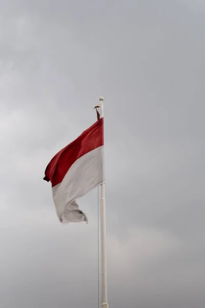 stock image The red and white flag of the Republic of Indonesia still flies in the afternoon