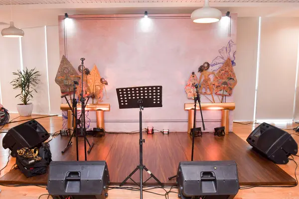 ministage music indoor with wayang decorations