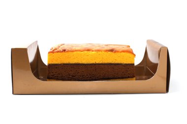 Lapis Surabaya or Surabaya layer cake, is an Indonesian three layer rich sponge cake and strawberry jam in between, isolated on white background