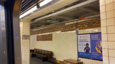 This video shows a subway station stop in New York City.