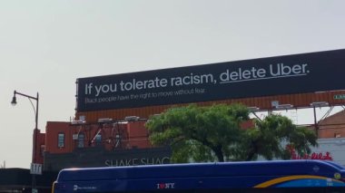 This video shows views of businesses and a billboard sign near Barclays Center in downtown Brooklyn.  Barclays Center is a multi-purpose indoor arena in the New York City borough of Brooklyn and is home to the NBAs Brooklyn Nets. 