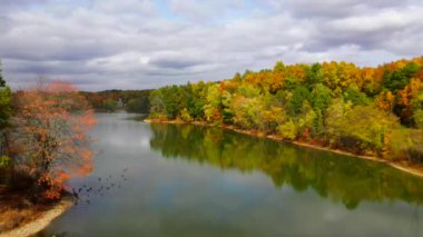 This morning time video shows gorgeous aerial views of low-altitude clouds in the middle of the countryside.  