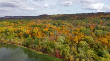 This morning time video shows gorgeous aerial views of low-altitude clouds in the middle of the countryside.  
