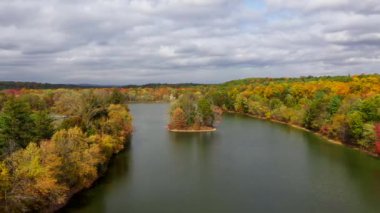 This video shows gorgeous aerial views of colorful trees during the fall season.