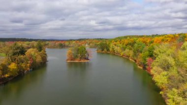 This video shows gorgeous aerial views of colorful trees during the fall season.