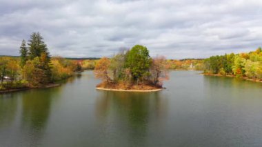 This video shows gorgeous aerial views of colorful trees during the fall season.