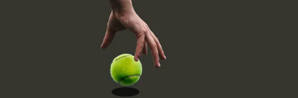 Tennis player bounces the ball in their hand before serving it.