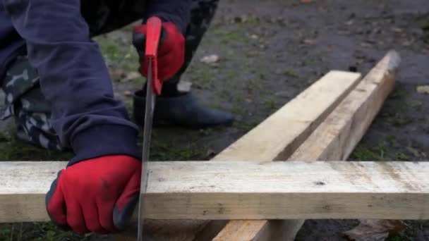 Man Cutting Wood Stick Floor Building Site Man Cutting Wooden — Vídeos de Stock