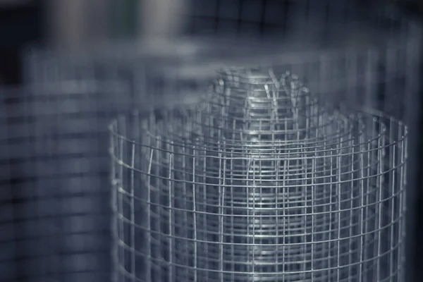 Metal mesh close-up, metal background slightly blurred. Metal grid for welding. Metal construction for ventilation