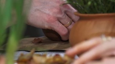 Clay workshop master classes. The hands of children and adults make pottery. Soft selective focus