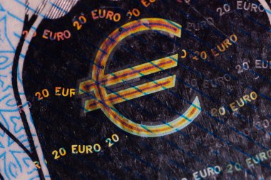 A twenty euro banknote. Euro money macro close-up. Separate information about the European Union euro cash, which has a nominal value of twenty euros. Savings for the concept of financial freedom. clipart