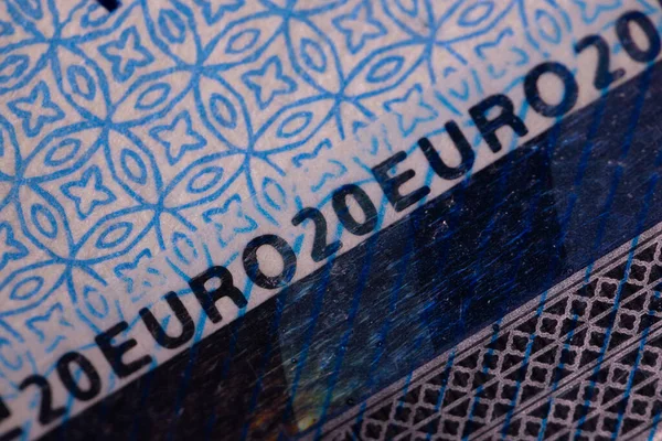 A twenty euro banknote. Euro money macro close-up. Separate information about the European Union euro cash, which has a nominal value of twenty euros. Savings for the concept of financial freedom.