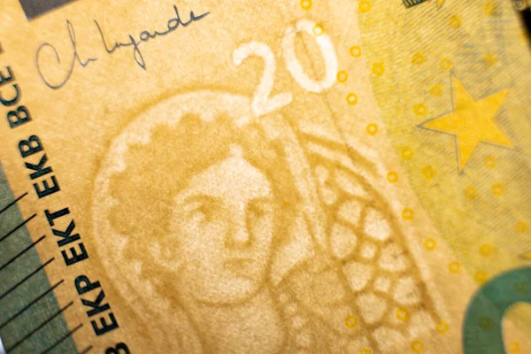 A twenty euro banknote. Euro money macro close-up. Separate information about the European Union euro cash, which has a nominal value of twenty euros. Savings for the concept of financial freedom.