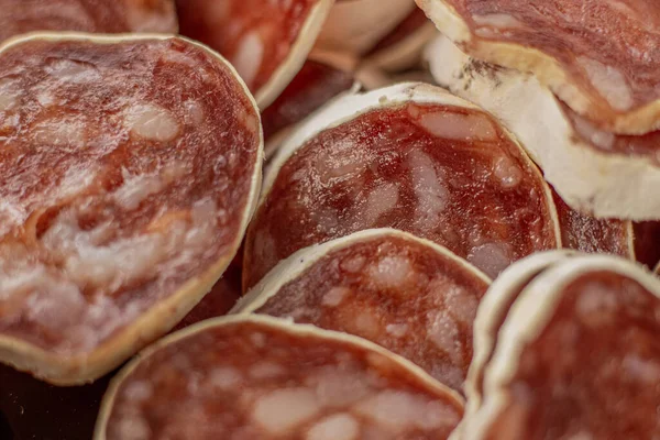 stock image Homemade salami, chorizo and other cured sausages. Dried sausages cut into thin slices