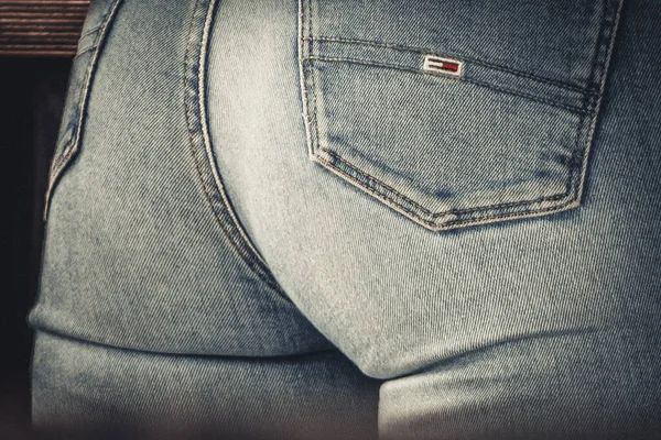 Women's bottom in jeans. A woman in jeans with a beautiful bottom. Concept of women's health