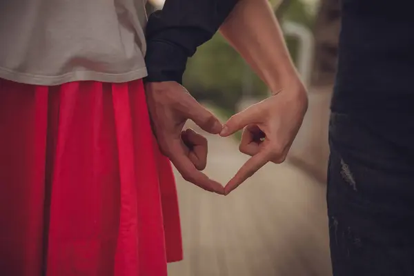 Happy Couple Holding Hands Red Attire Het Uiten Van Liefde — Stockfoto