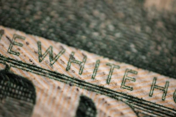 twenty paper dollar bill macro. Super Macro for a twenty dollar bill. Financial Wealth: Capital and Profit in Banking and Investment. Financial growth symbolized by currency and lettering.