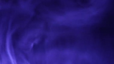 A close-up of soft, swirling blue smoke patterns creating an ethereal and dreamy abstract effect against a dark background