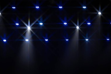 Sari ve mor sahne isiklarindan olusan dramatik bir dizi karanlikta parlak yildiz patlamalari olusturarak tavanin uzerinde ızgara gibi bir yapi olusturuyor. Soyut ve enerjik ışıklandırma görüntüsü.