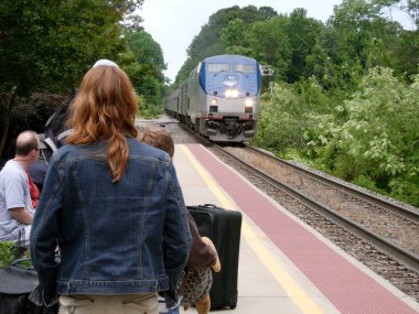 people at a train station clipart