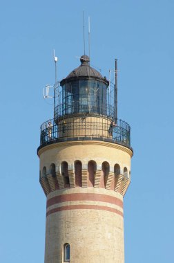 Lighthouse over blue sky 