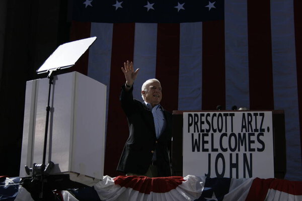 John McCain waves to the crowd